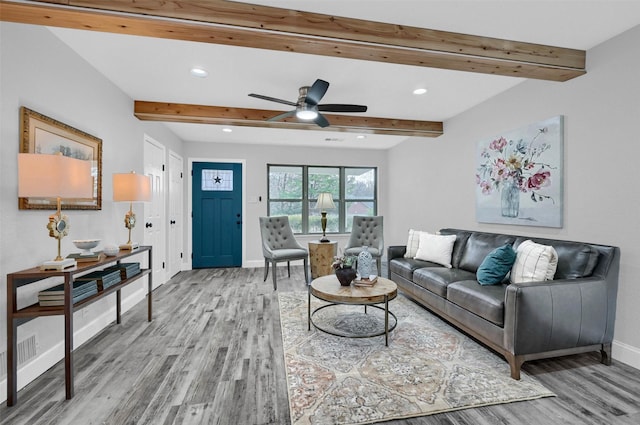 living room with beam ceiling, ceiling fan, and hardwood / wood-style floors