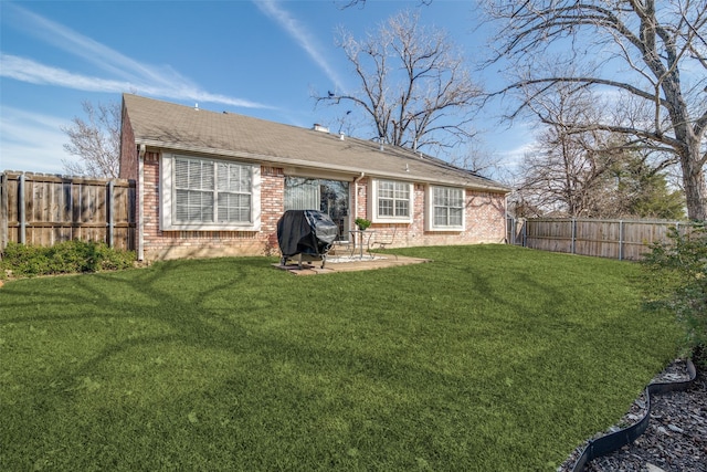 back of property featuring a patio and a yard