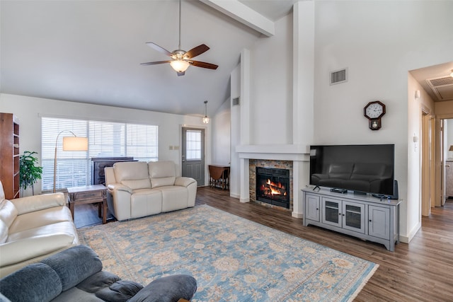 living room featuring high vaulted ceiling, dark hardwood / wood-style flooring, beam ceiling, and ceiling fan