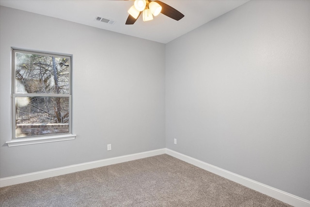 carpeted empty room featuring ceiling fan