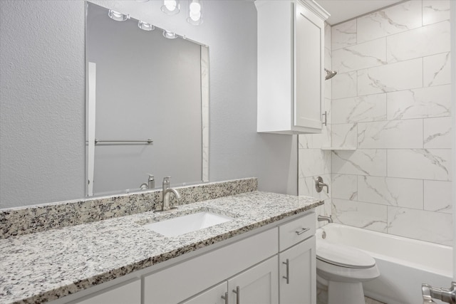 full bathroom featuring vanity, toilet, and tiled shower / bath combo