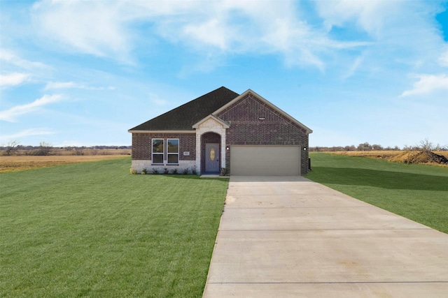 view of front facade with a garage and a front lawn