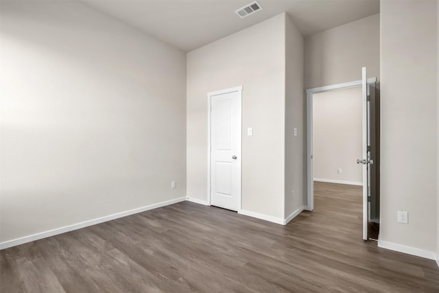 unfurnished bedroom featuring dark wood-type flooring