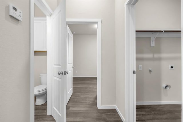 bathroom with wood-type flooring and toilet