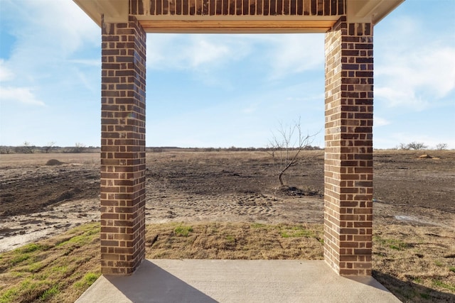 view of patio with a rural view