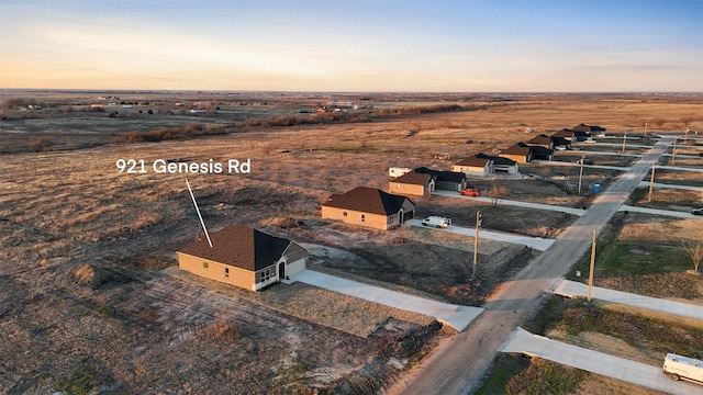 aerial view at dusk featuring a rural view