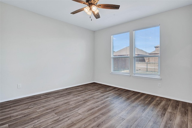 unfurnished room featuring ceiling fan and dark wood-type flooring