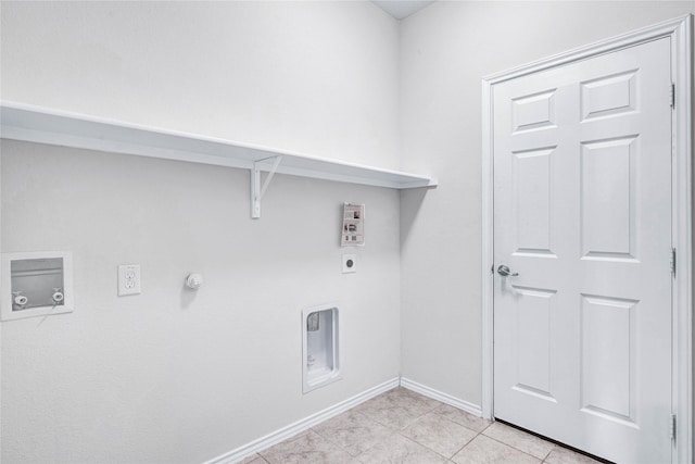 laundry area with hookup for a gas dryer, washer hookup, hookup for an electric dryer, and light tile patterned floors