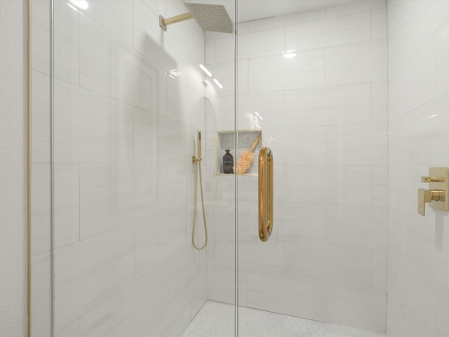 bathroom with tiled shower