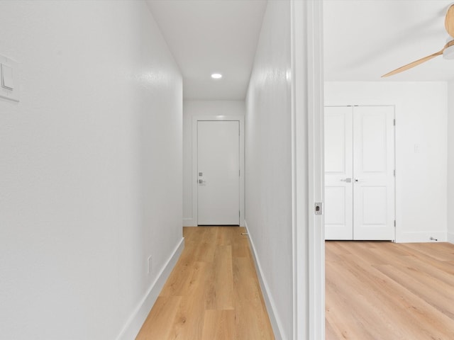 hallway with light wood-type flooring