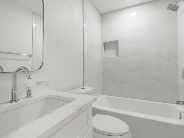 full bathroom featuring toilet, vanity, and tiled shower / bath combo