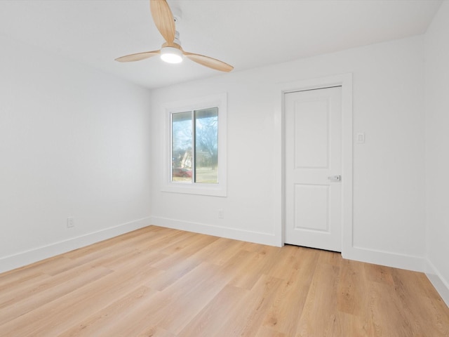 unfurnished room with ceiling fan and light hardwood / wood-style flooring