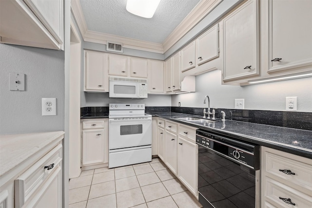 kitchen with white cabinets, white appliances, and a textured ceiling