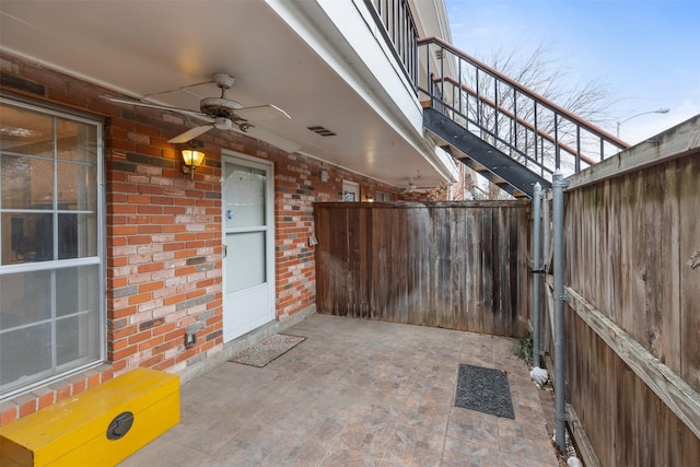 view of patio featuring ceiling fan