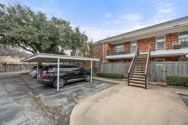 view of parking / parking lot with a carport