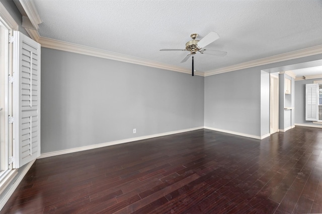 spare room with ceiling fan, dark wood-type flooring, a textured ceiling, and crown molding