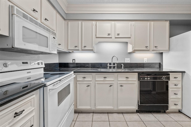 kitchen with sink, light tile patterned floors, white appliances, ornamental molding, and white cabinets