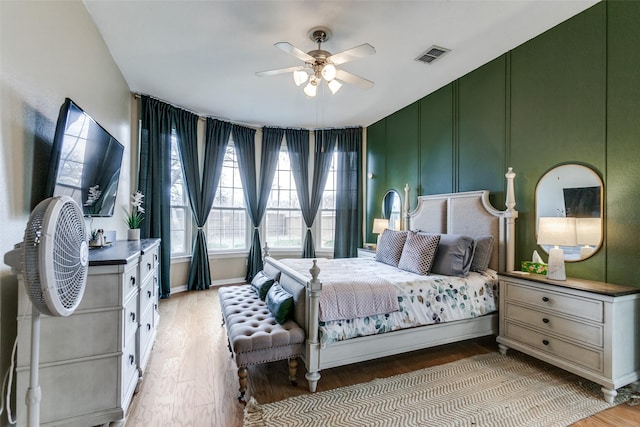 bedroom with ceiling fan and light hardwood / wood-style flooring