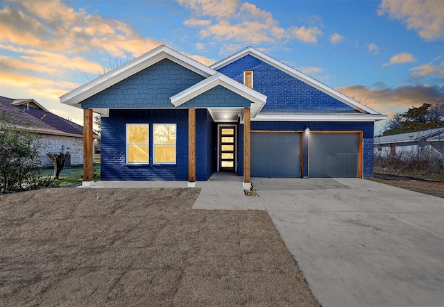 view of front of property with a garage