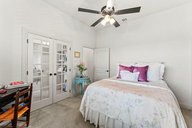 carpeted bedroom featuring ceiling fan, french doors, and lofted ceiling