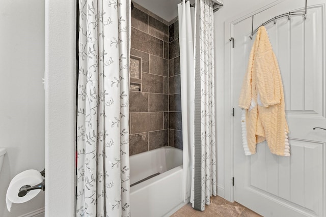 bathroom featuring tile patterned floors and shower / tub combo