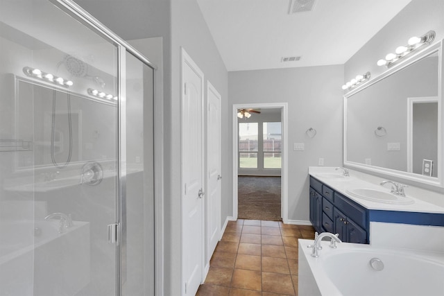 full bath with visible vents, a shower stall, and a sink