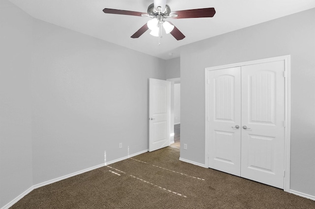 unfurnished bedroom featuring a ceiling fan, carpet, baseboards, and a closet