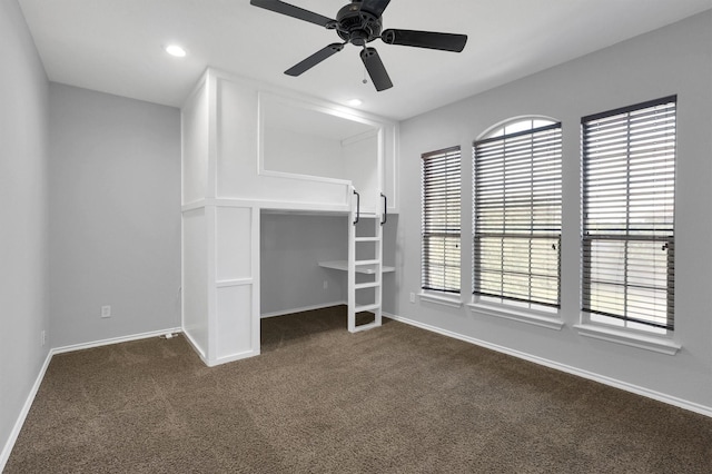 unfurnished bedroom with a ceiling fan, recessed lighting, baseboards, and dark carpet