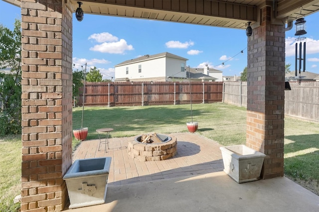 view of patio / terrace featuring a fenced backyard and an outdoor fire pit