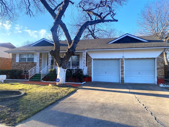 single story home with a front yard and a garage