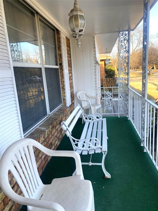 balcony featuring a porch