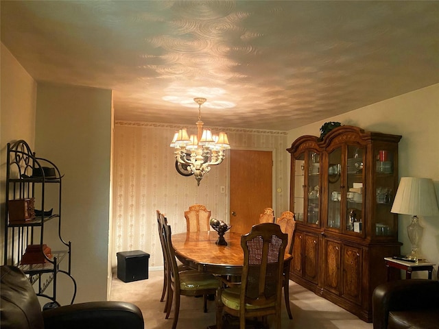 dining room with light carpet and an inviting chandelier