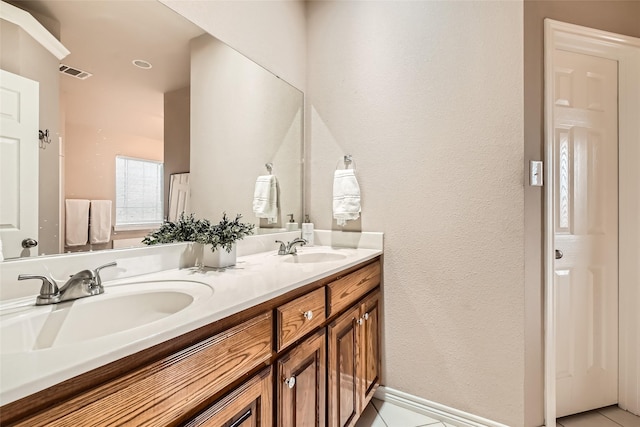 bathroom featuring vanity and tile patterned floors