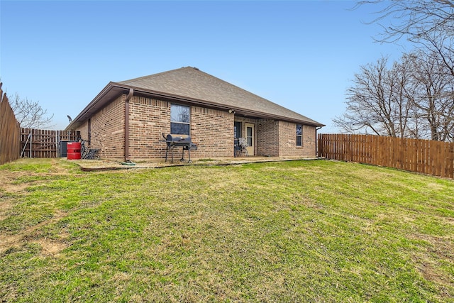 rear view of house with a lawn