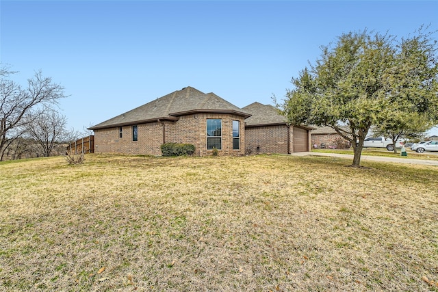 view of front facade featuring a garage and a front lawn