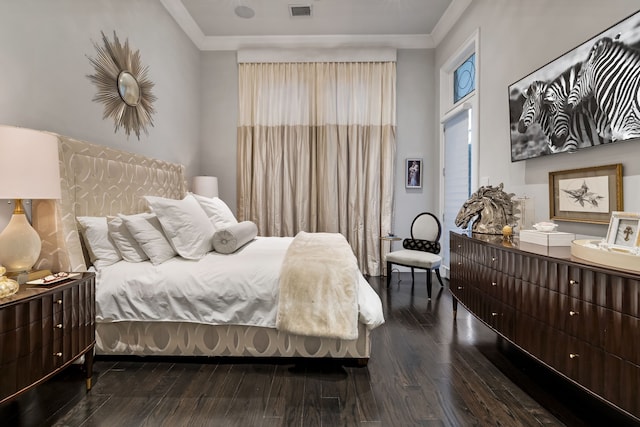 bedroom featuring dark hardwood / wood-style flooring and ornamental molding