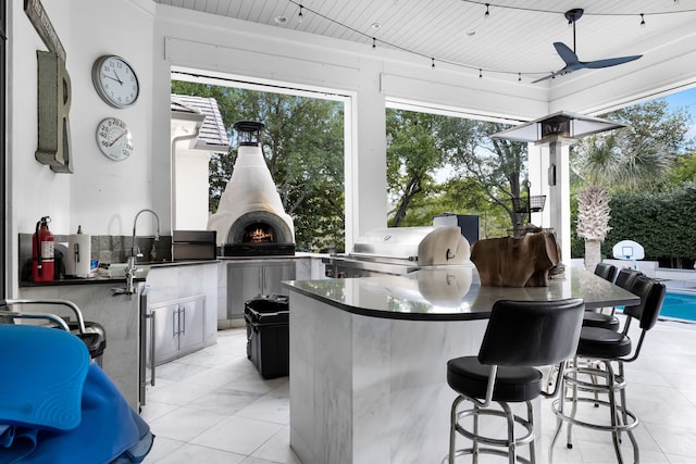 exterior space featuring wooden ceiling and ceiling fan