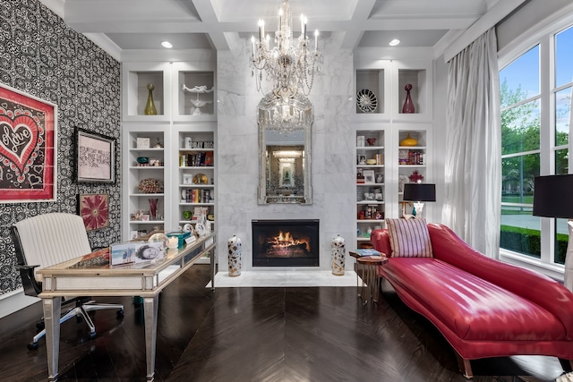 office area featuring built in shelves, beamed ceiling, and coffered ceiling