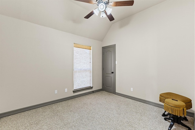 spare room featuring ceiling fan and lofted ceiling