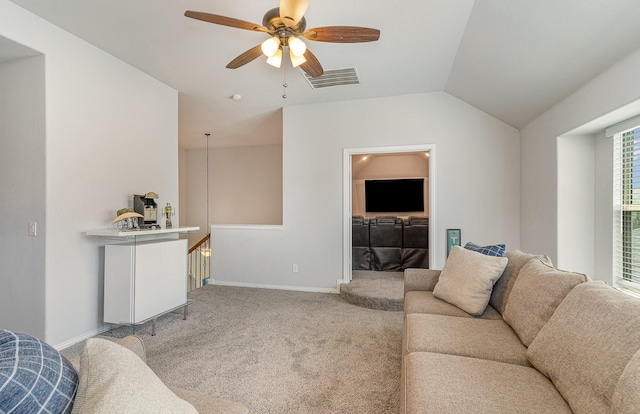 living room featuring ceiling fan, light carpet, and vaulted ceiling