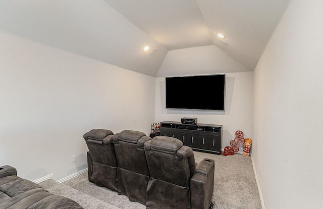 carpeted home theater room featuring lofted ceiling