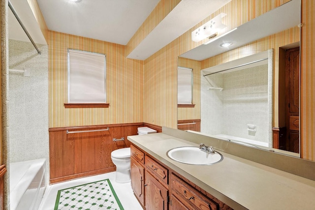 bathroom featuring toilet, vanity, a shower, and wood walls