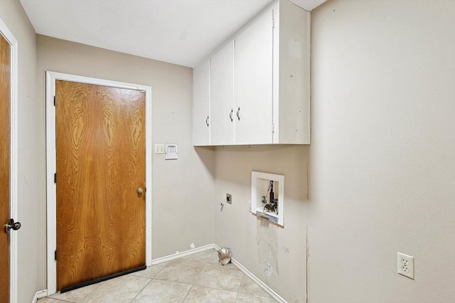 washroom with washer hookup, cabinets, light tile patterned floors, and hookup for an electric dryer