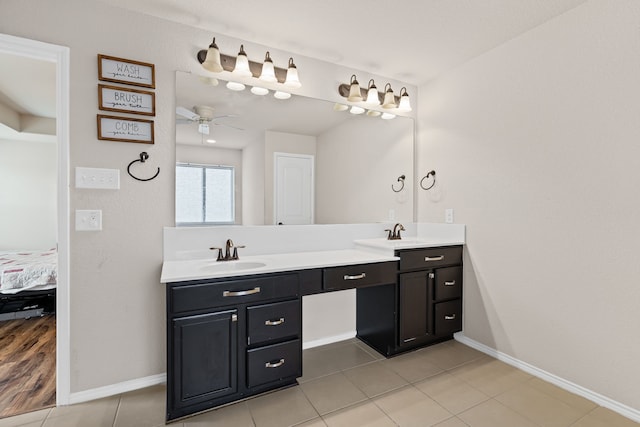 bathroom featuring vanity, tile patterned flooring, and ceiling fan