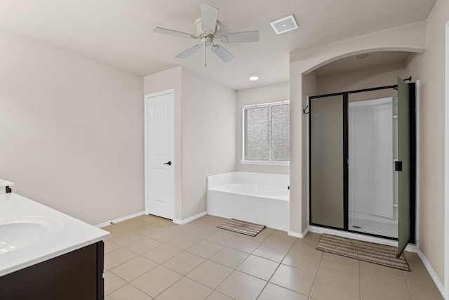 bathroom with ceiling fan, vanity, separate shower and tub, and tile patterned flooring