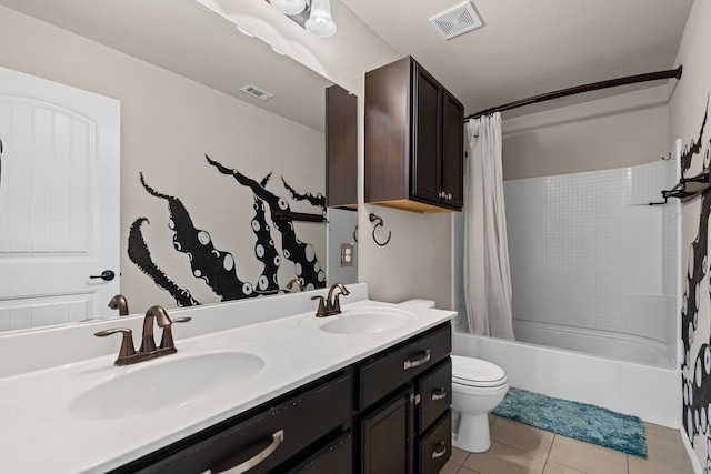 full bathroom with shower / bath combination with curtain, vanity, toilet, tile patterned floors, and a textured ceiling