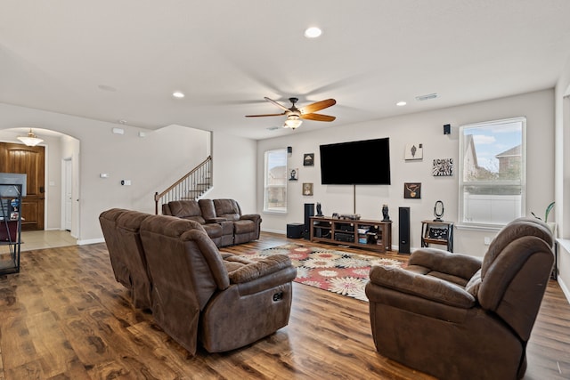 living room featuring hardwood / wood-style flooring and ceiling fan