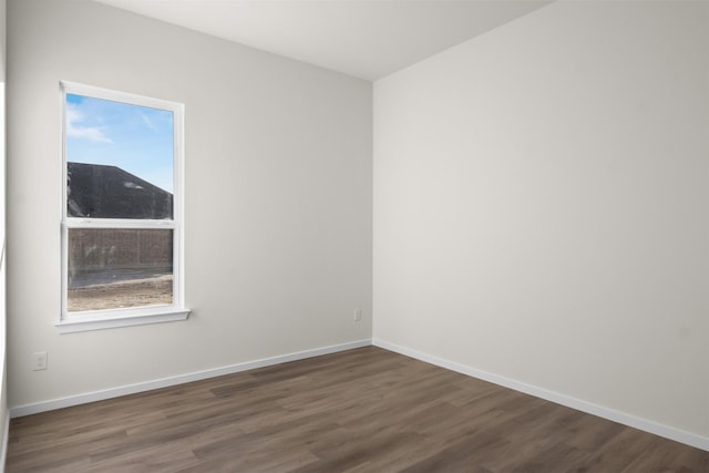 empty room featuring dark hardwood / wood-style flooring