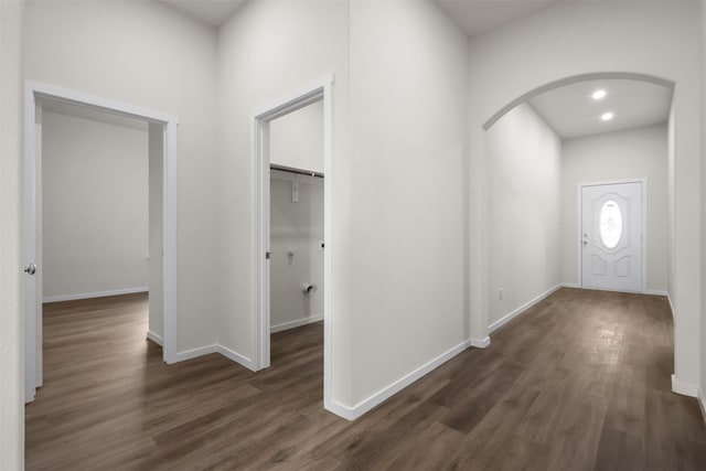 corridor with dark hardwood / wood-style floors