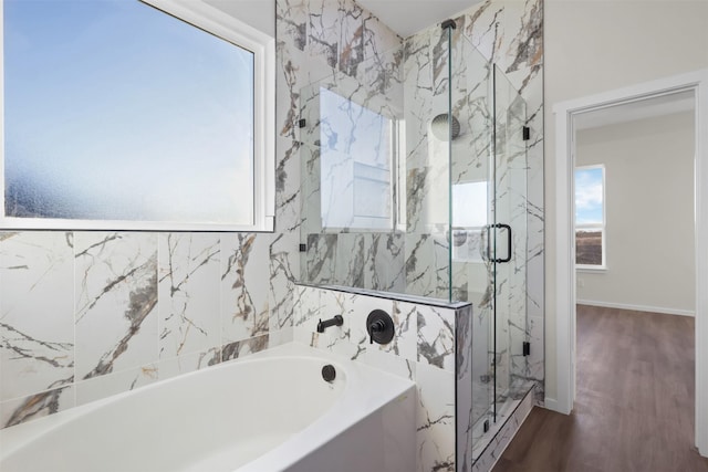 bathroom featuring hardwood / wood-style floors and plus walk in shower